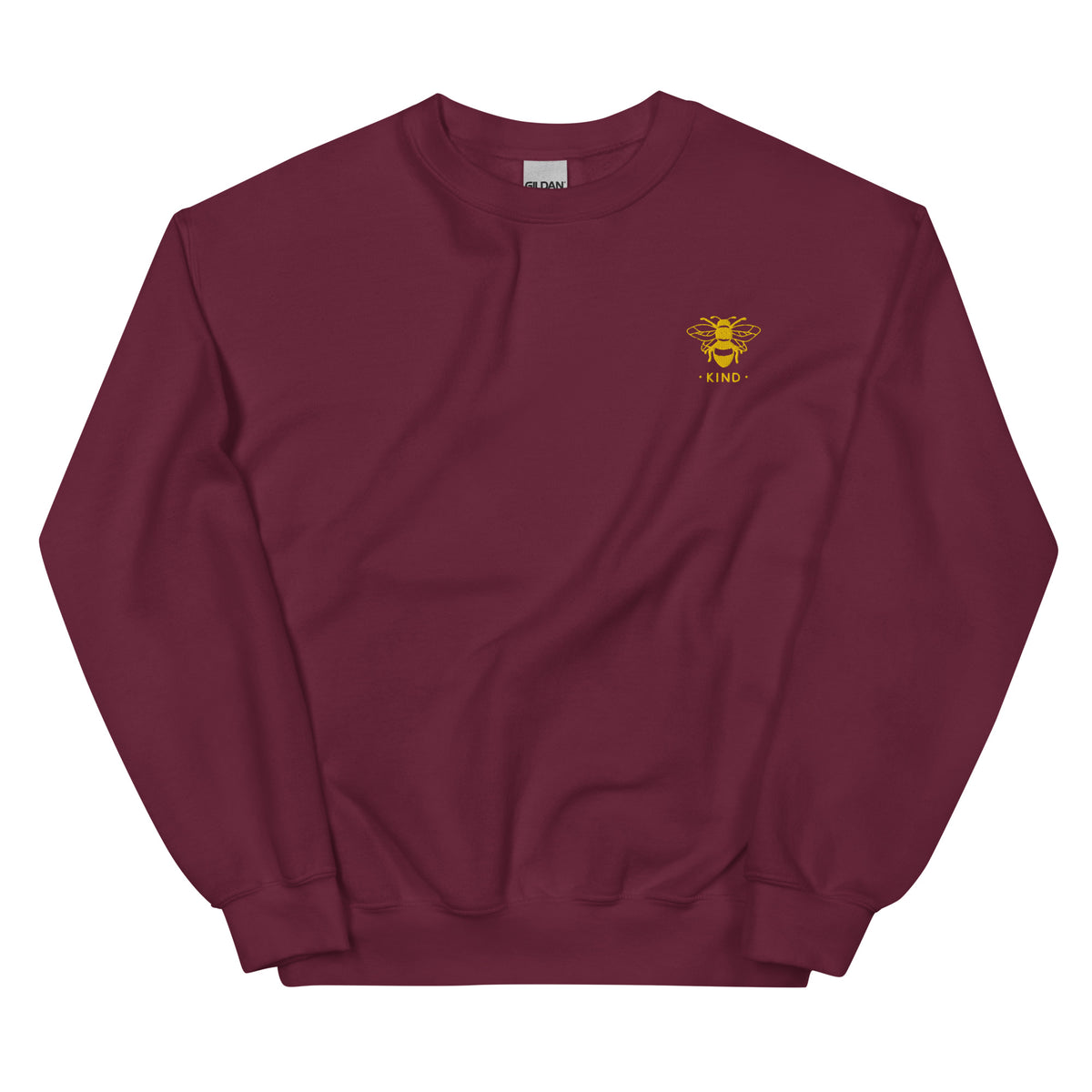unisex warm sweater in the colour maroon heather with a small golden bee embroidery on left chest and the word kind